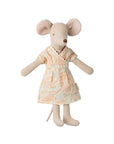 The Maileg Mum Mouse by Maileg features large ears and light-colored clothes with an orange floral pattern. She stands upright against a white background and is perfect for pairing with other Maileg mouse accessories.