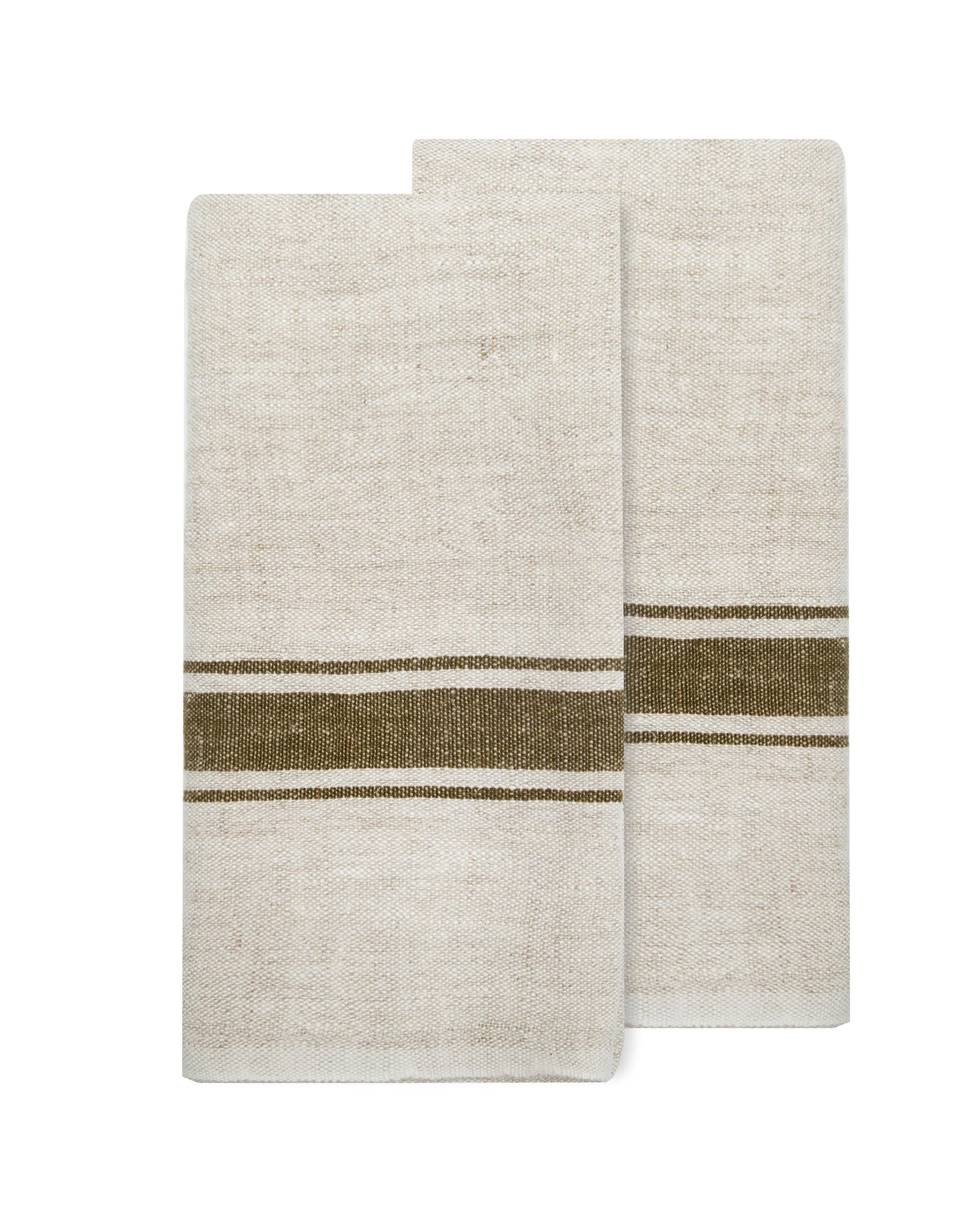 The Caravan Marseille Linen Towel Set-2 in beige, each with a brown horizontal stripe near the bottom, is shown laid flat and slightly overlapping against a white background.