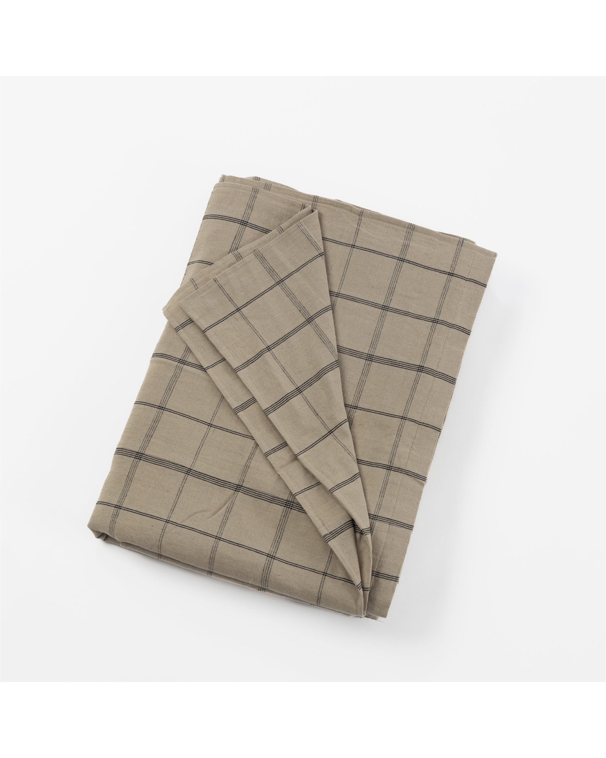 The Nelson Duvet Coverlet by Amity Home features folded beige cotton-linen blend fabric with a dark gray grid pattern, reminiscent of a windowpane, displayed on a white background.