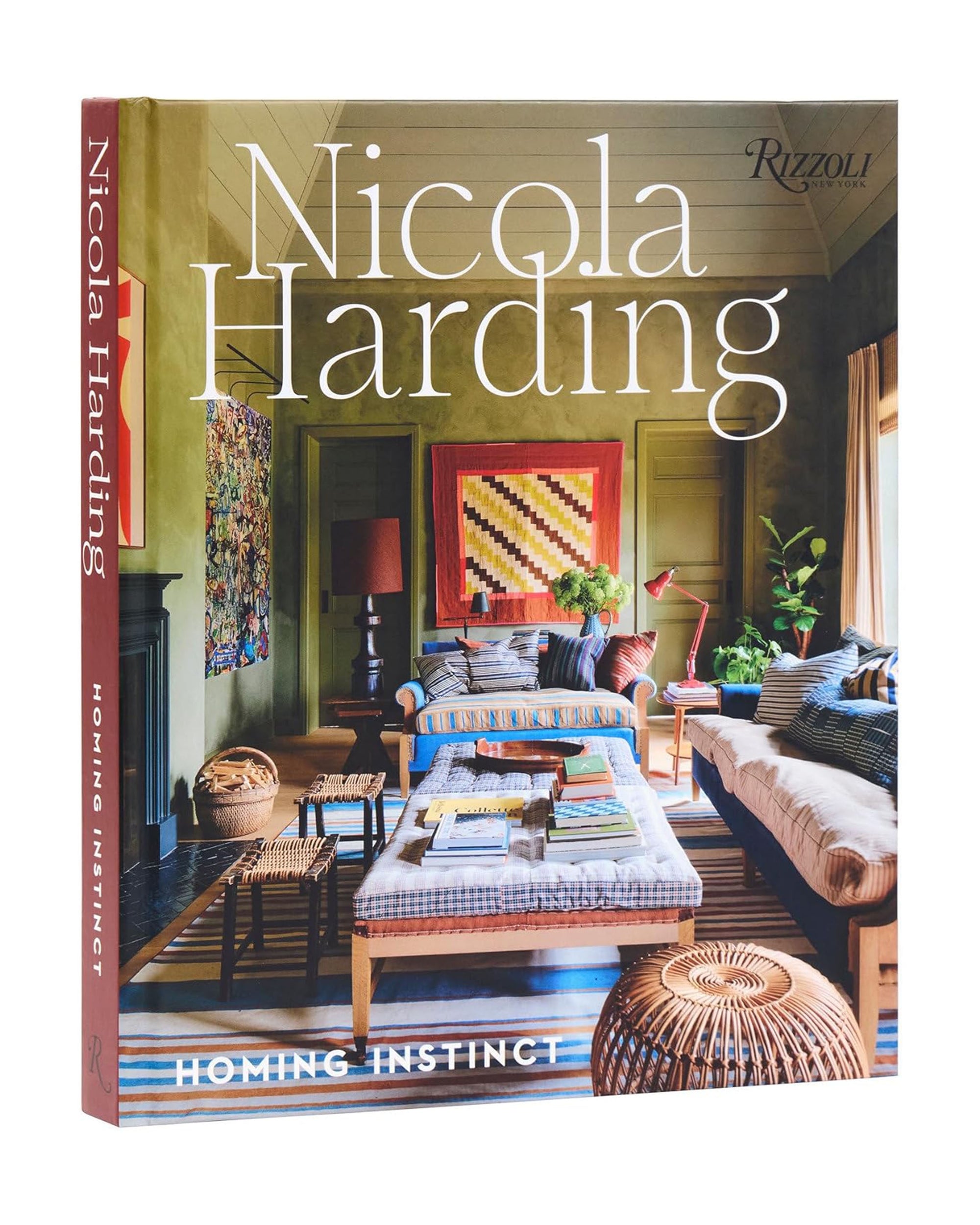 Book cover of "Nicola Harding Homing Instinct" by Random House, featuring a cozy, colorful British-inspired living room with sofas, coffee tables, books, plants, and antiques.