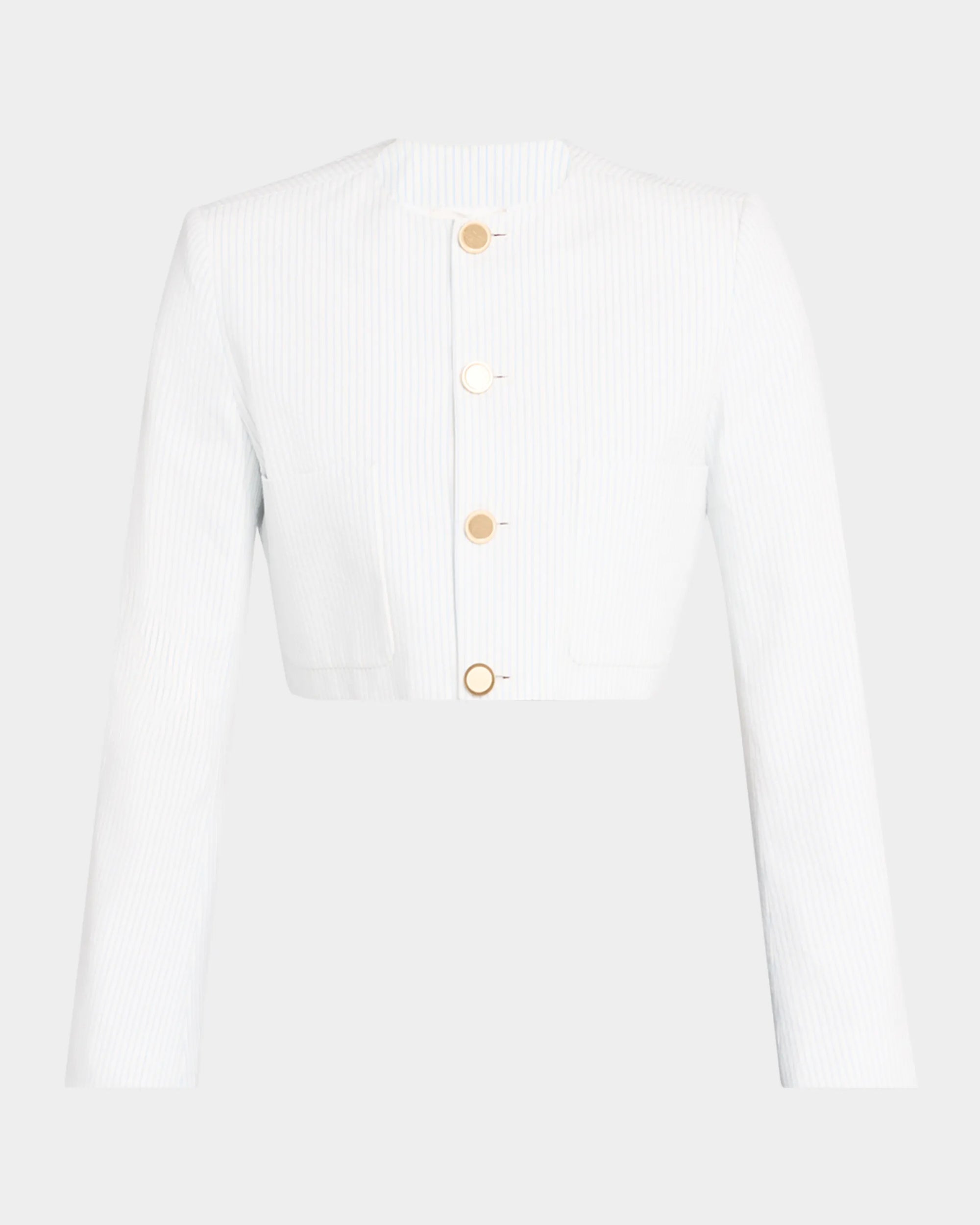 The Seersucker Jacket by FRAME is a white, cropped, long-sleeve blazer with subtle vertical stripes, four gold buttons, a round collarless neckline, and structured seersucker fabric for added style.