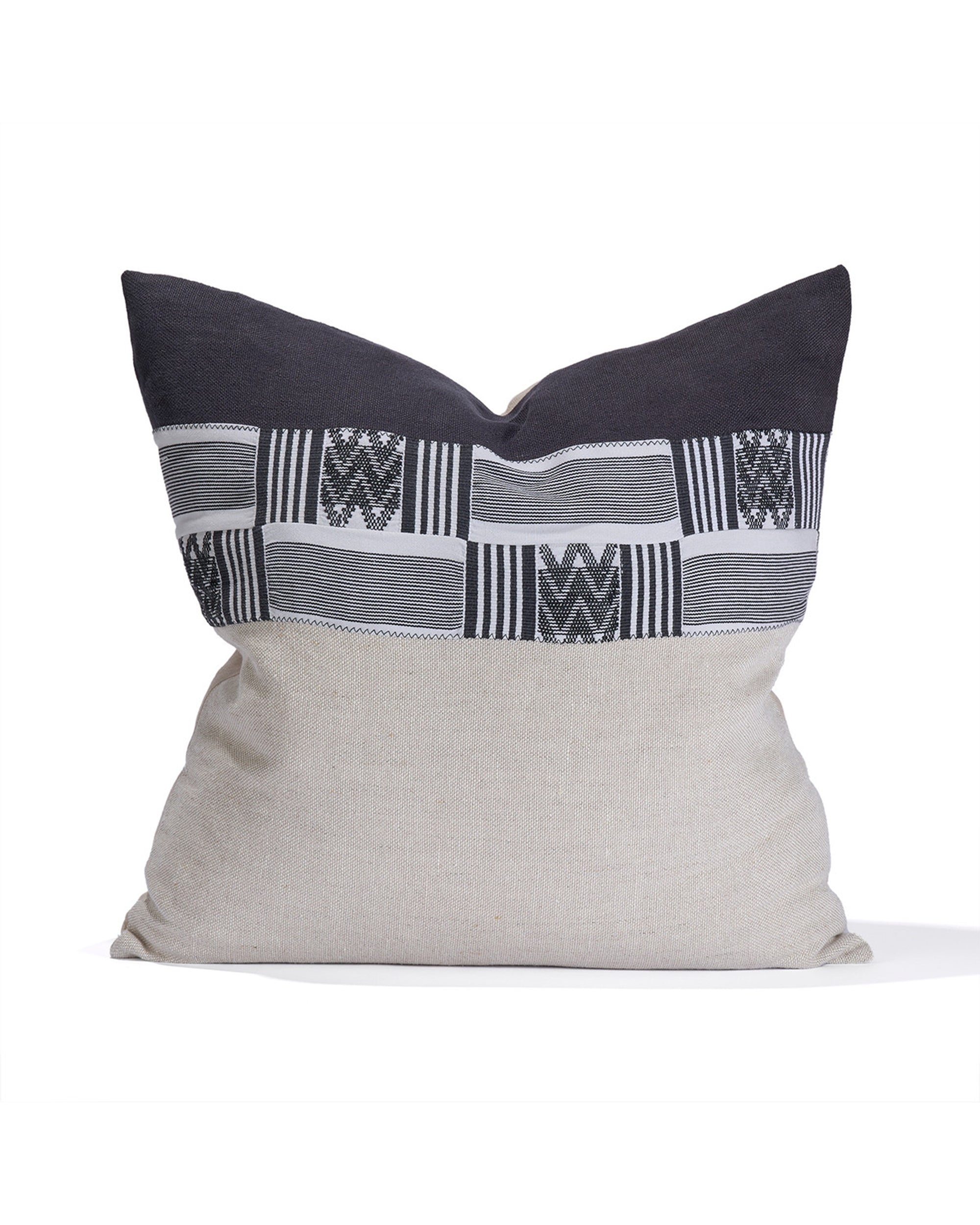The House Of Cindy Noir Pillow 22 X22 is handcrafted in Los Angeles, featuring a beige lower half, dark upper half, and a geometric black, gray, and white patterned strip near the top.