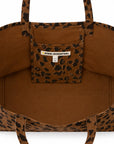 Brown cheetah print canvas tote with inner pocket, Kerri Rosenthal label above pocket, Bungalow Furniture & Accessories.