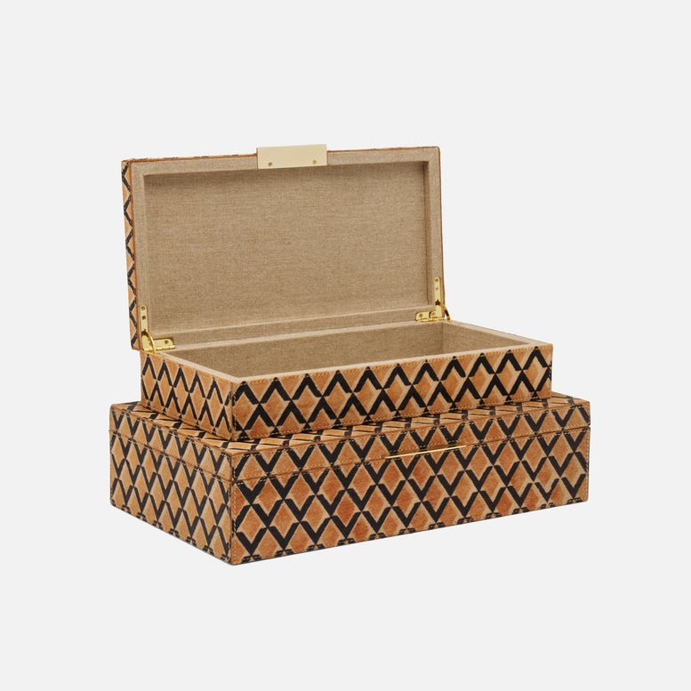 The Zion Hair on Hide Box by Made Goods features a rectangular shape with a hinged lid. Its exterior displays an elegant brown and black geometric diamond pattern, while the fabric-lined interior adds a refined finish.