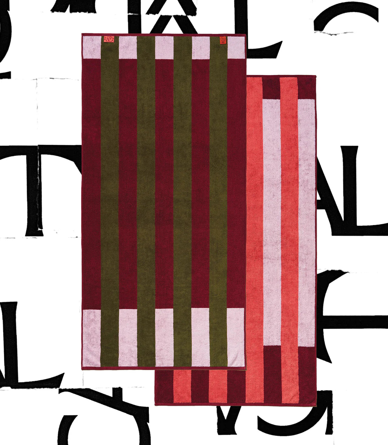 Two Typical Pink/Burgundy Stripe Bath Towels are layered on a white background with bold black lettering. The rectangular towels feature vertical stripes in burgundy, olive green, pink, and red.