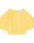 The Opihi Bubble Sleeve Crop Top by Mikoh is a bright yellow, 100% cotton blouse with wide, flowing bubble sleeves and a round neckline. The blouse features a small keyhole opening with a button at the back and an elasticized hem for a gathered look.