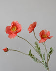 The Faire 22'' Single Flocked Floral Poppy Spray features vibrant orange blooms and one bud on green, textured stems—perfect artificial flowers to brighten any space against a light grey background.