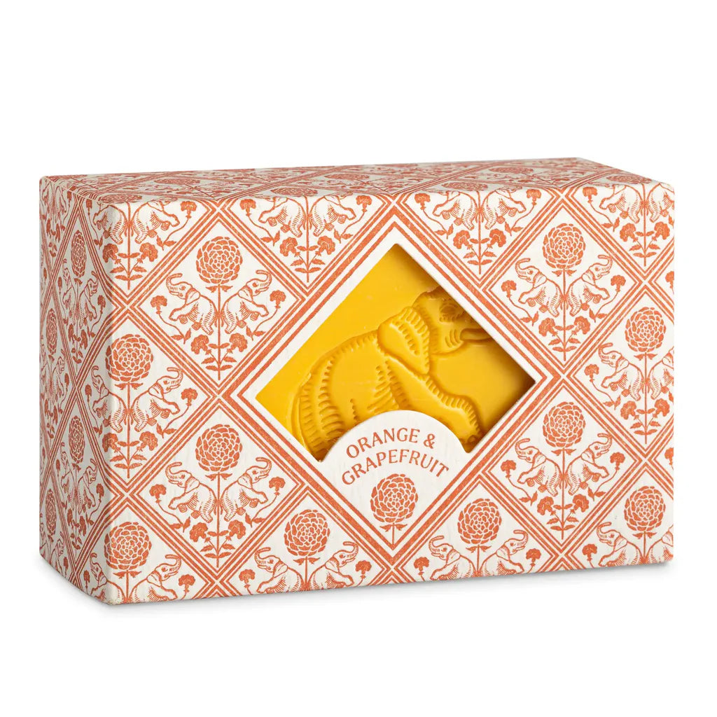 A decorative Provence box with an orange floral pattern and diamond window reveals Faire's Hand and Body Soap Bar, embossed and labeled "Orange & Grapefruit.