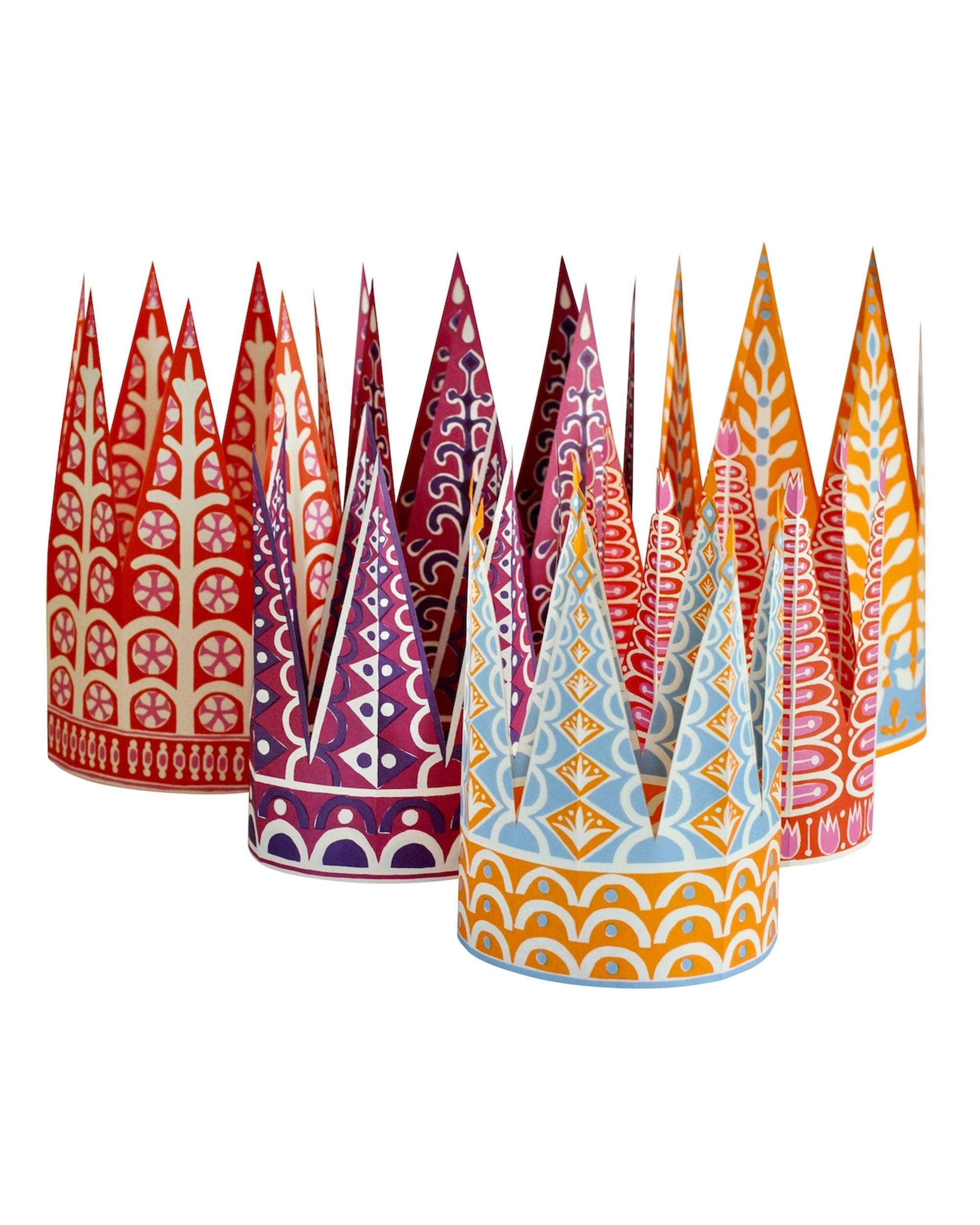 Six Crowns by Faire features colorful, patterned crowns in red, purple, blue, and yellow on a white background. These unique party hats are biodegradable and recyclable—ideal for eco-friendly celebrations.