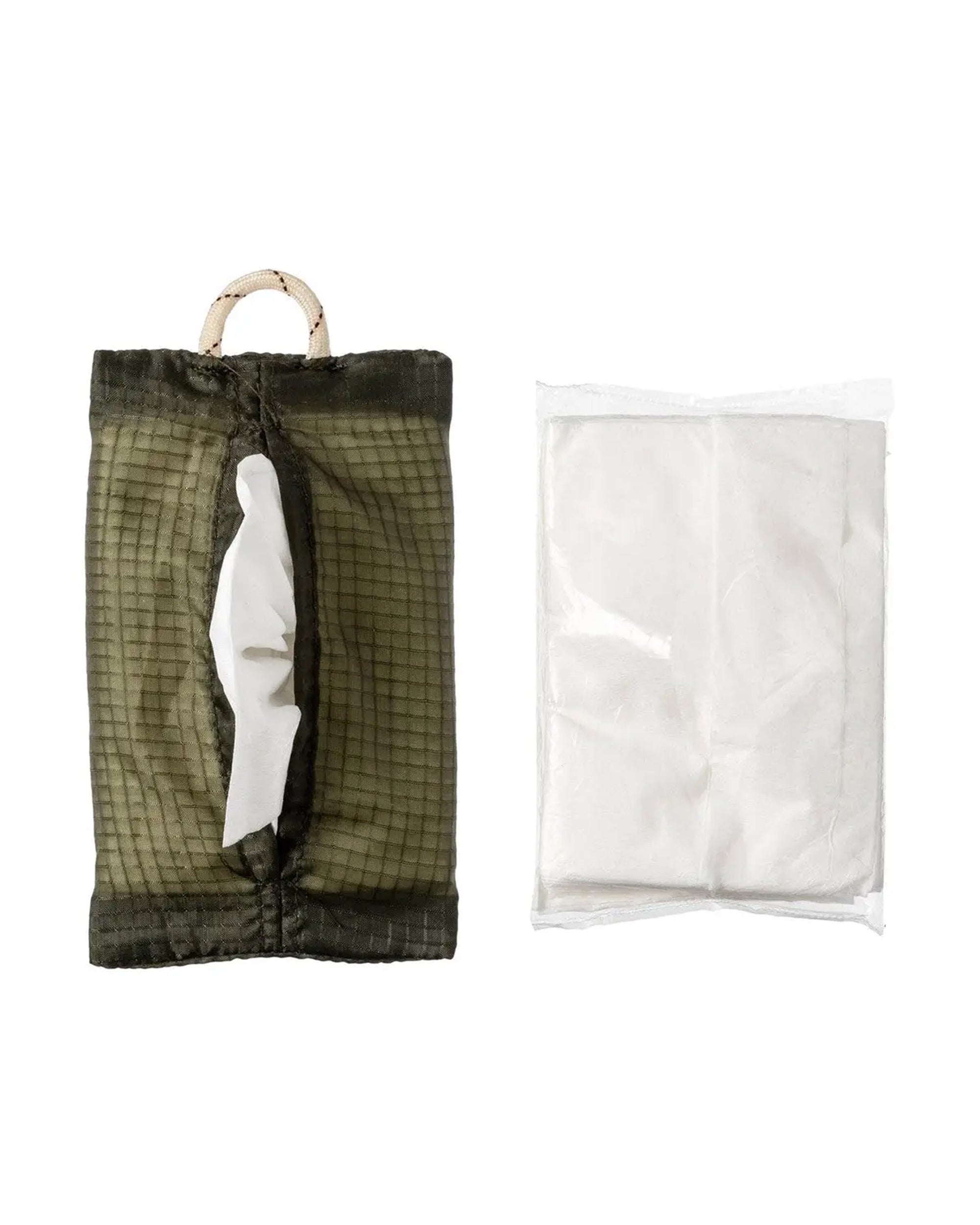 The Faire Parachute Tissue Cover, crafted from vintage green parachute fabric with a handle and filled with white tissues, sits next to a clear plastic-wrapped pack of folded white tissues on a white background.