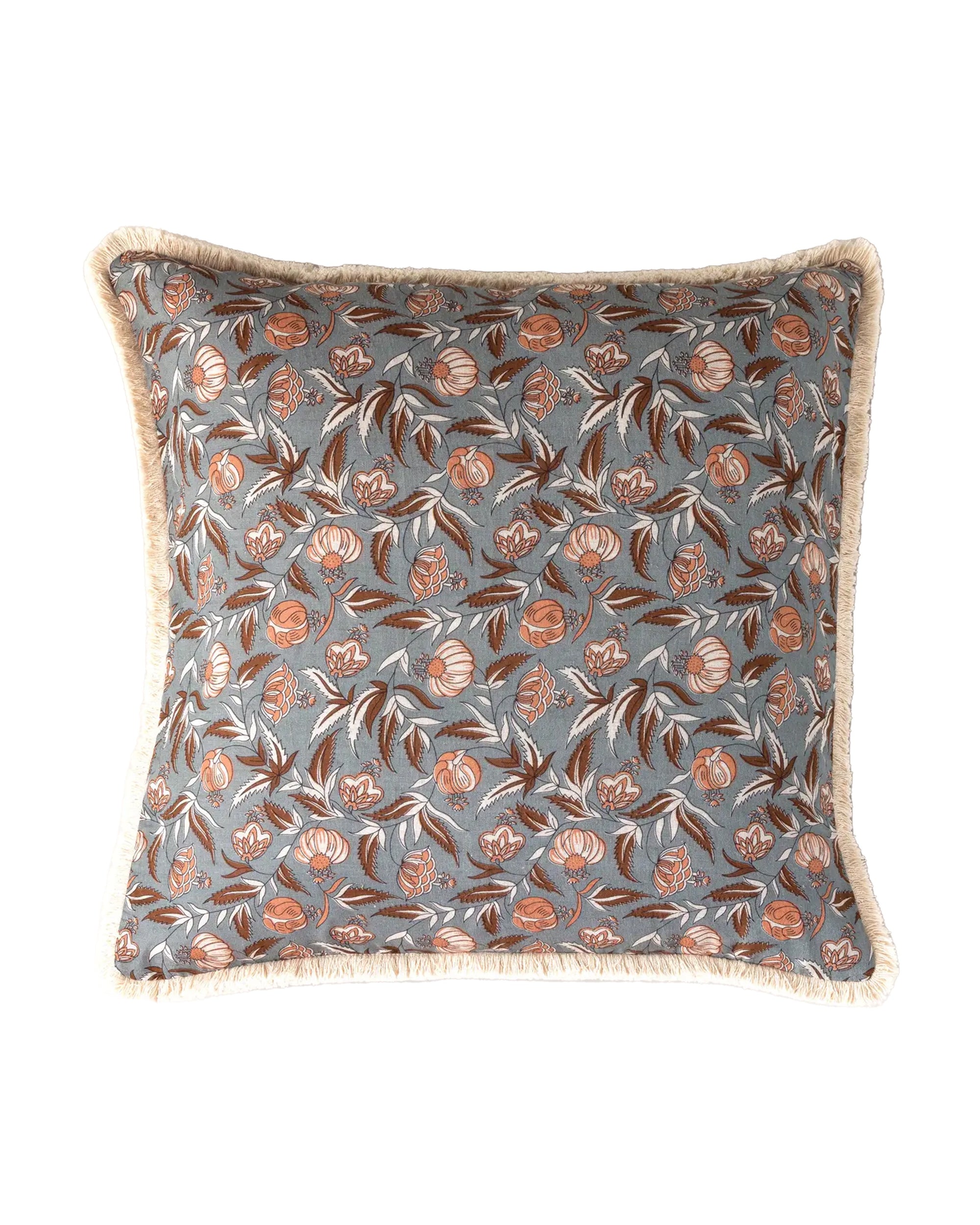 The Faire Block Print Pillow features a square shape, blue background, botanical brown and white floral print, and beige fringe trim—an ideal vintage accent for any living space.