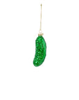 The Accent Decor Pickle Ornament is a glittery green, hand-painted glass ornament hanging from a thin gold string against a plain white background.