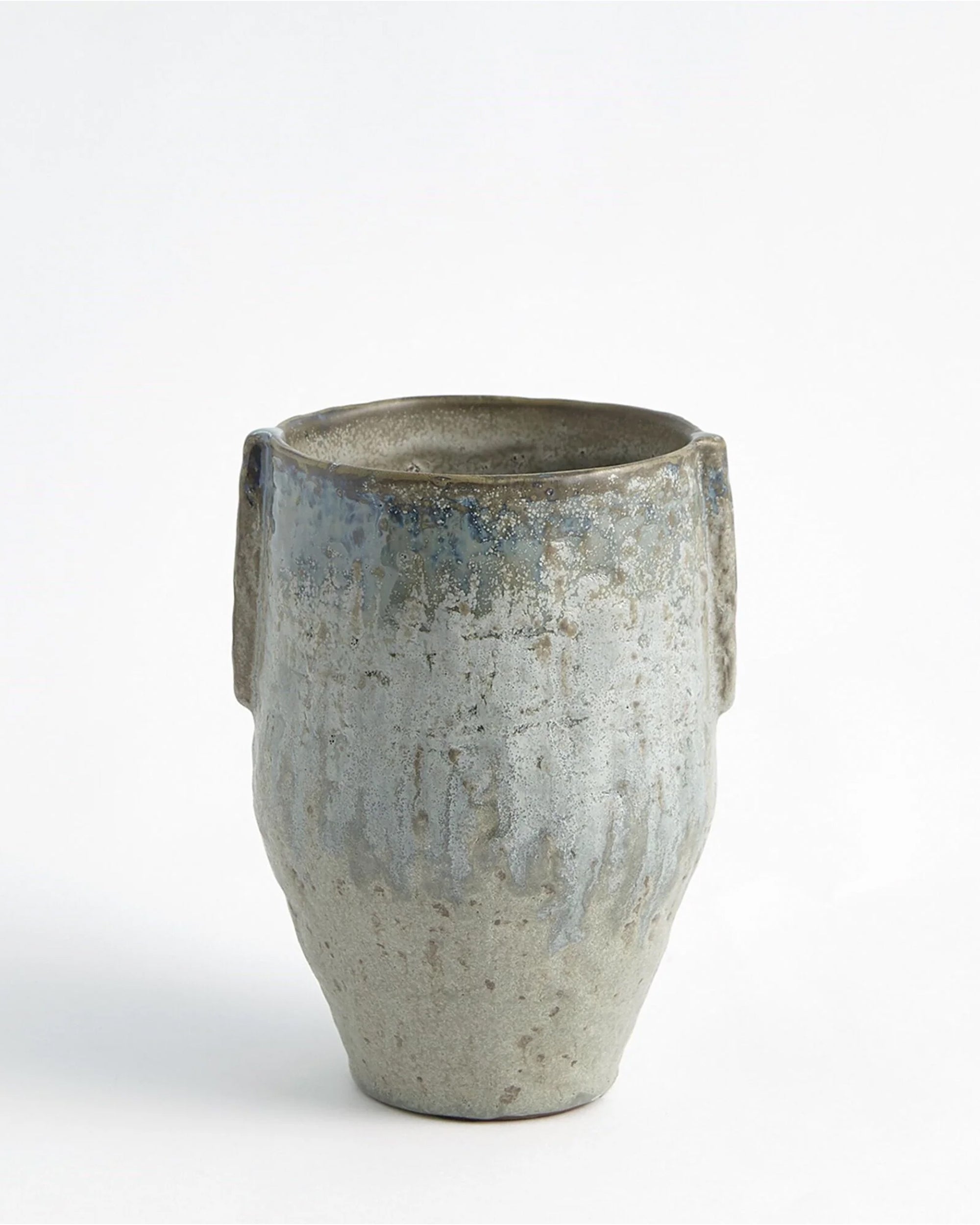 The 7.80605 Pinch Pot Vase Sm by Global Views is a handmade vase with a textured, uneven surface, subtle sea-foam glaze, two small side handles, and gentle color variations, shown against a plain white background.