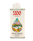 A metal can of Faire Pineapple Coconut Oil features a colorful tropical illustration with pineapples, coconuts, flowers, and a beach scene—perfect for hydrating hair and body.