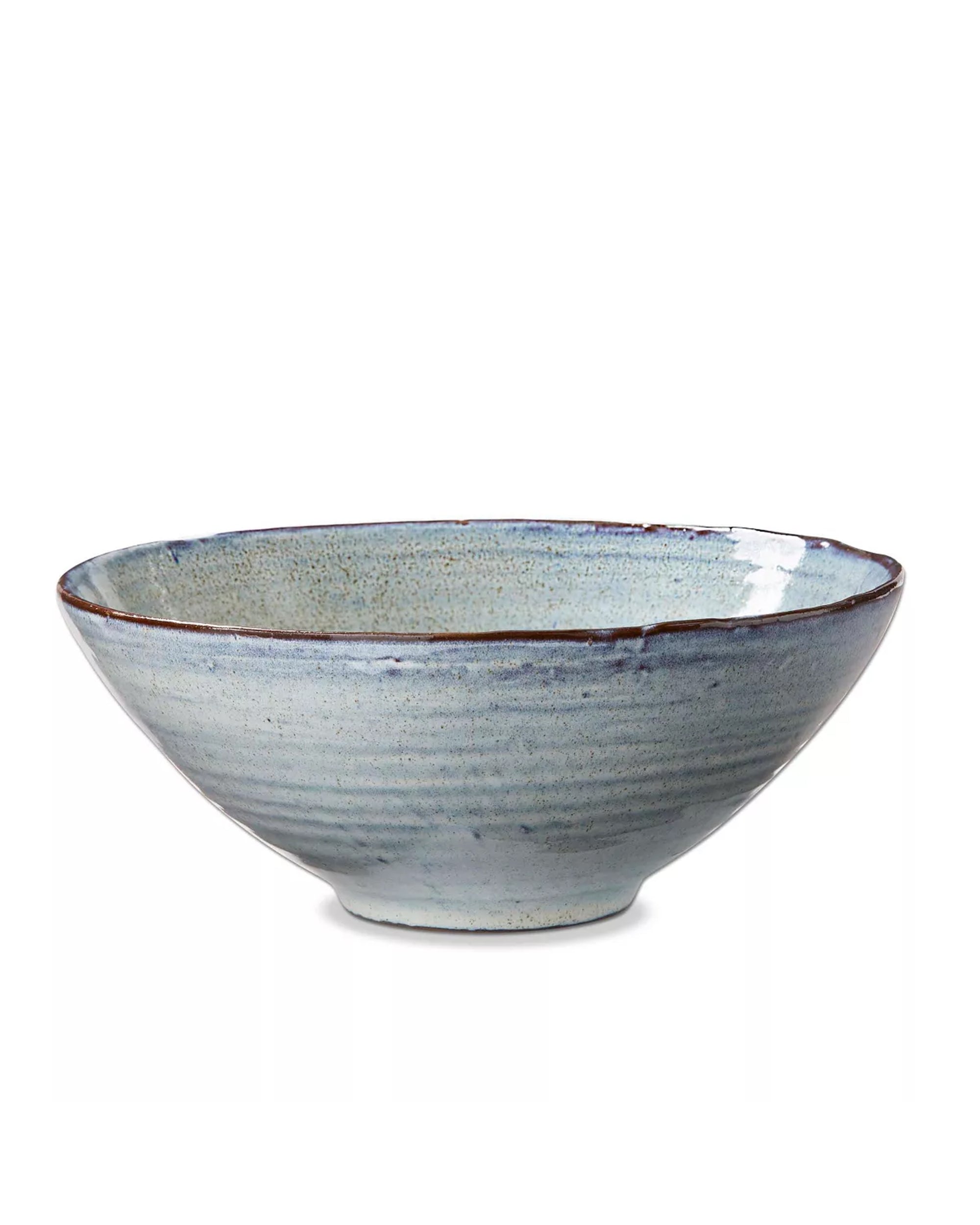 The Tag Porto Bowl Large is a handmade ceramic serving bowl with a wide, shallow shape, subtle blue-grey glaze, slightly uneven rim, and textured surface—perfect for family-style meals or as an elegant salad bowl.