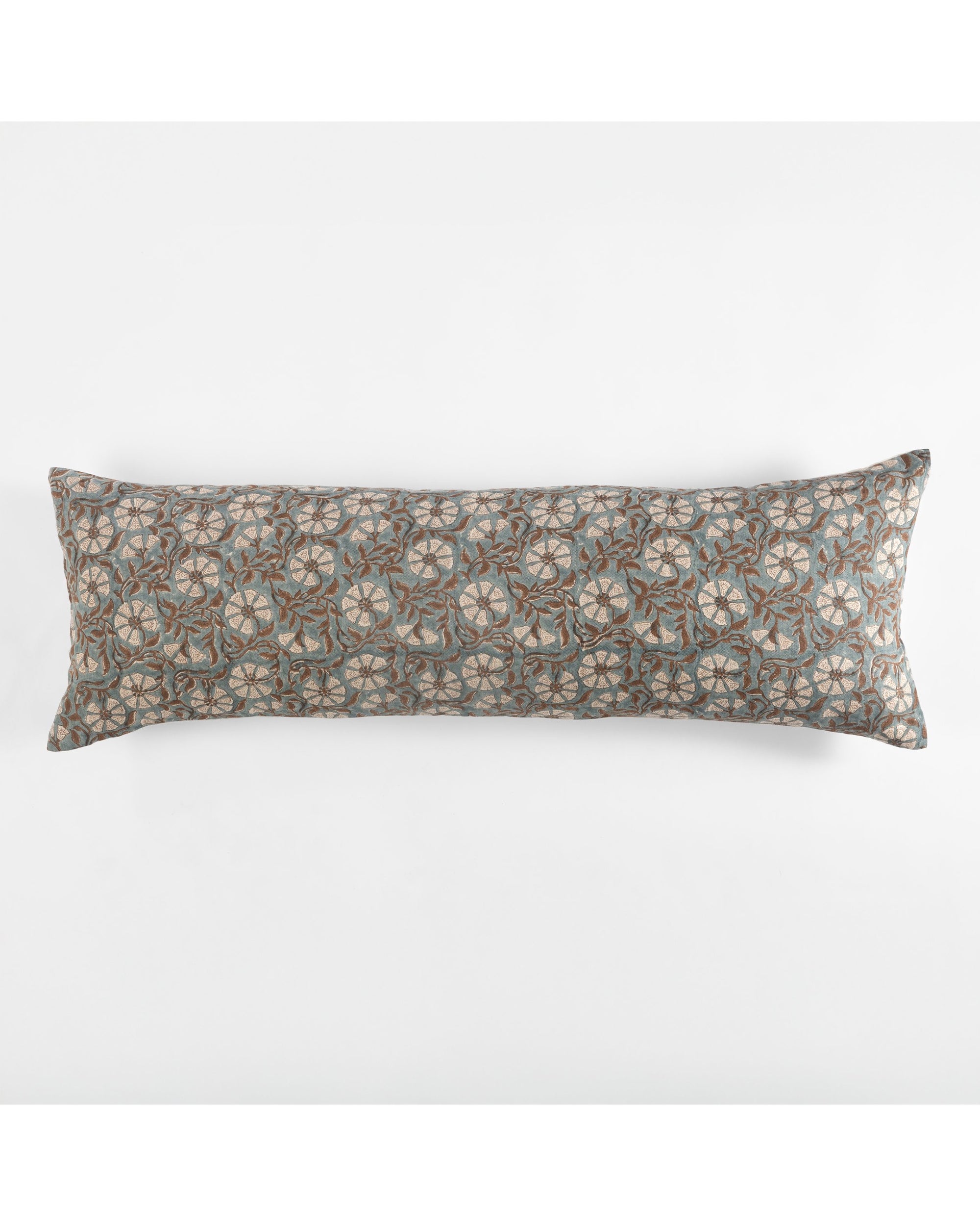 The Amity Home Priya X Long Bolster features a repeating circular pattern in blue, gray, and beige on a white background.