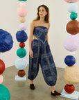 Hunter Bell NYC Briggs Pant in a bright gallery, styled playfully among colorful paper mâché spheres for a lively look.