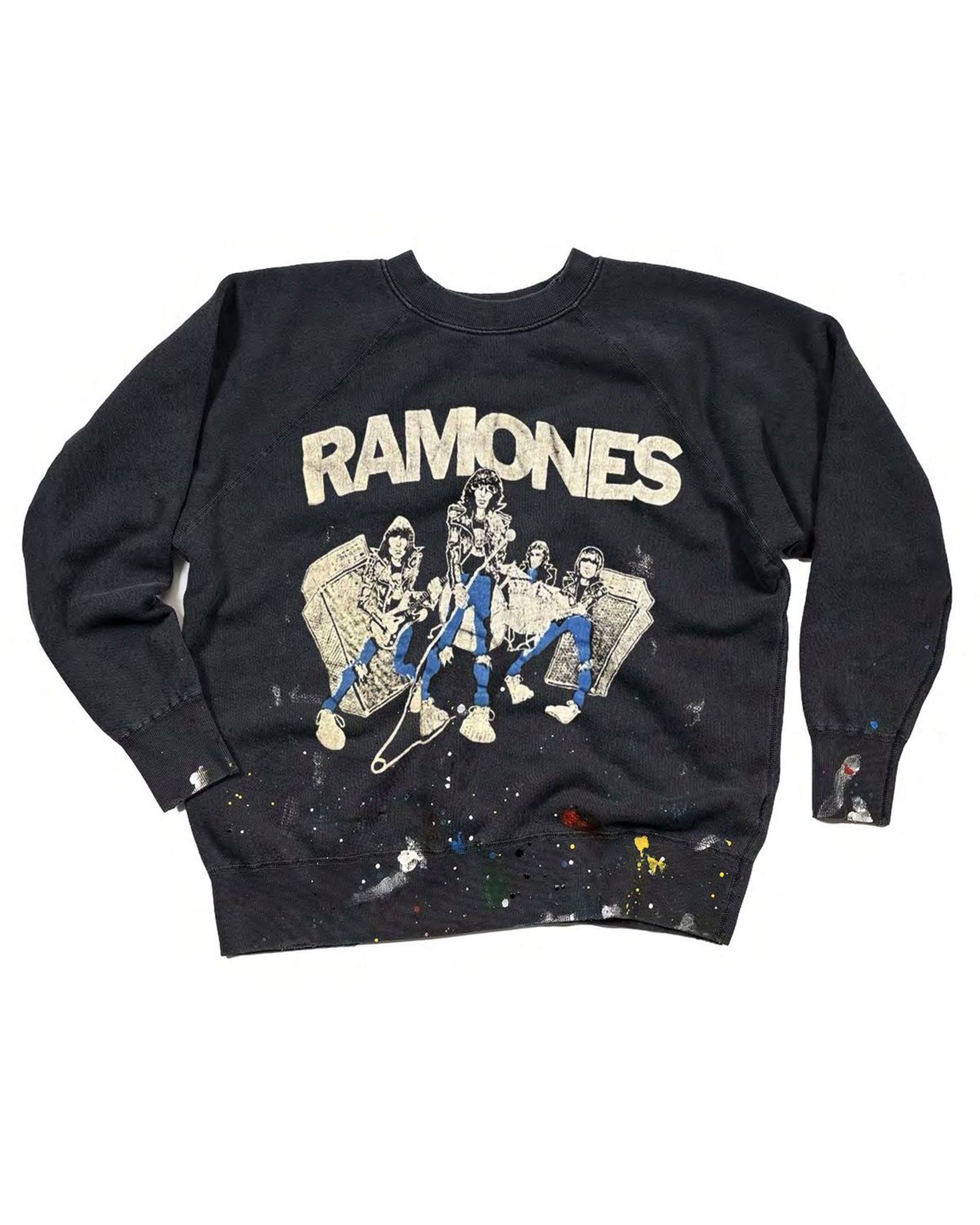 The Ramones Shrunken LS Sweatshirt by Made Worn features bold "RAMONES" text, a cartoon of the four band members sitting, and unique paint splatters on the sleeves and lower front.