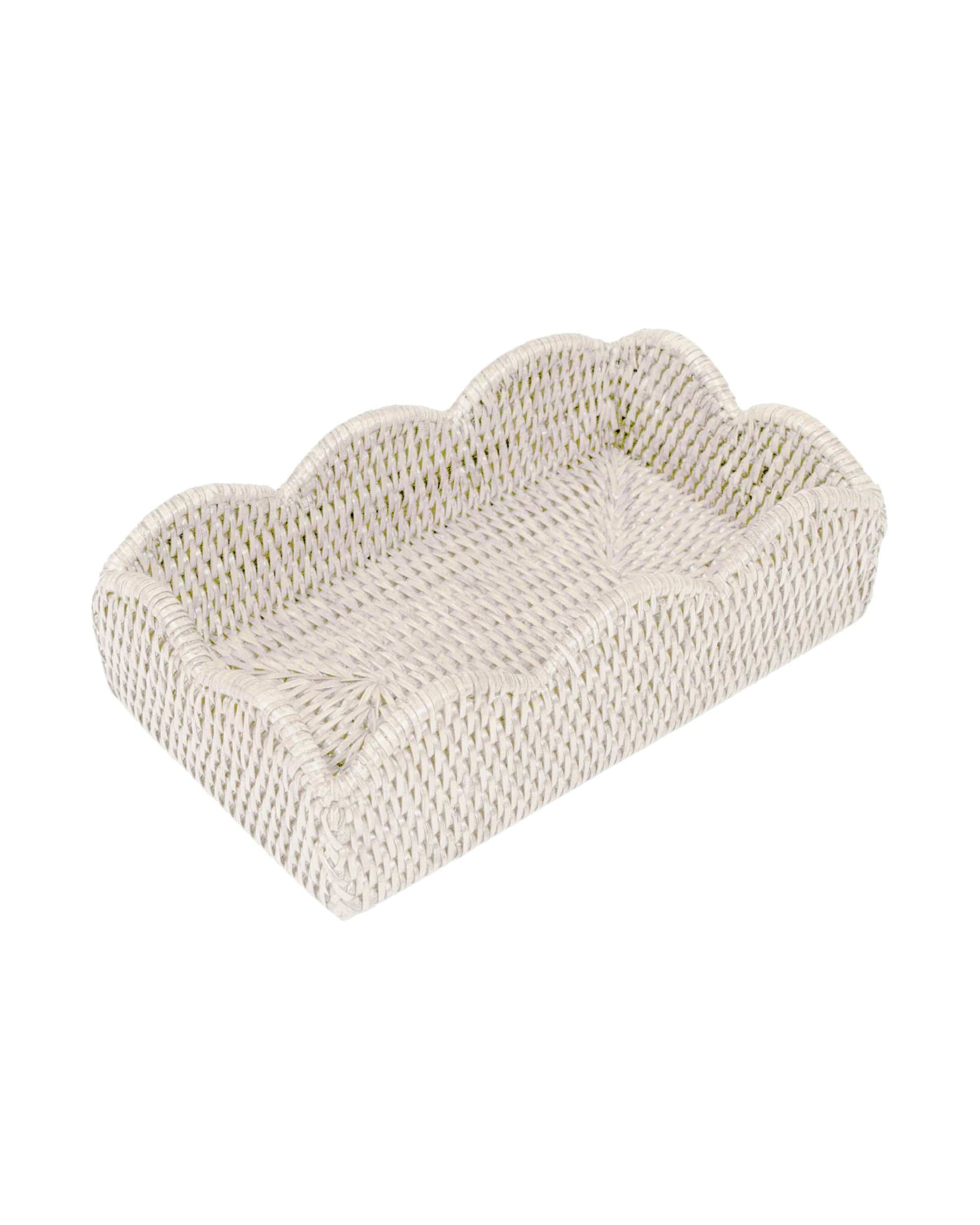 The Caspari, Inc. Rattan Scallop Guest Towel Holder features a rectangular woven design with scalloped edges in a light, natural shade—ideal for holding napkins or organizing small items as stylish tabletop decor.