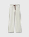 The Rag & Bone rb miramar trry drwcrd wde leg pants are loose-fitting, off-white denim-look terry cloth with a drawstring waist and two front pockets, shown on a plain white background.