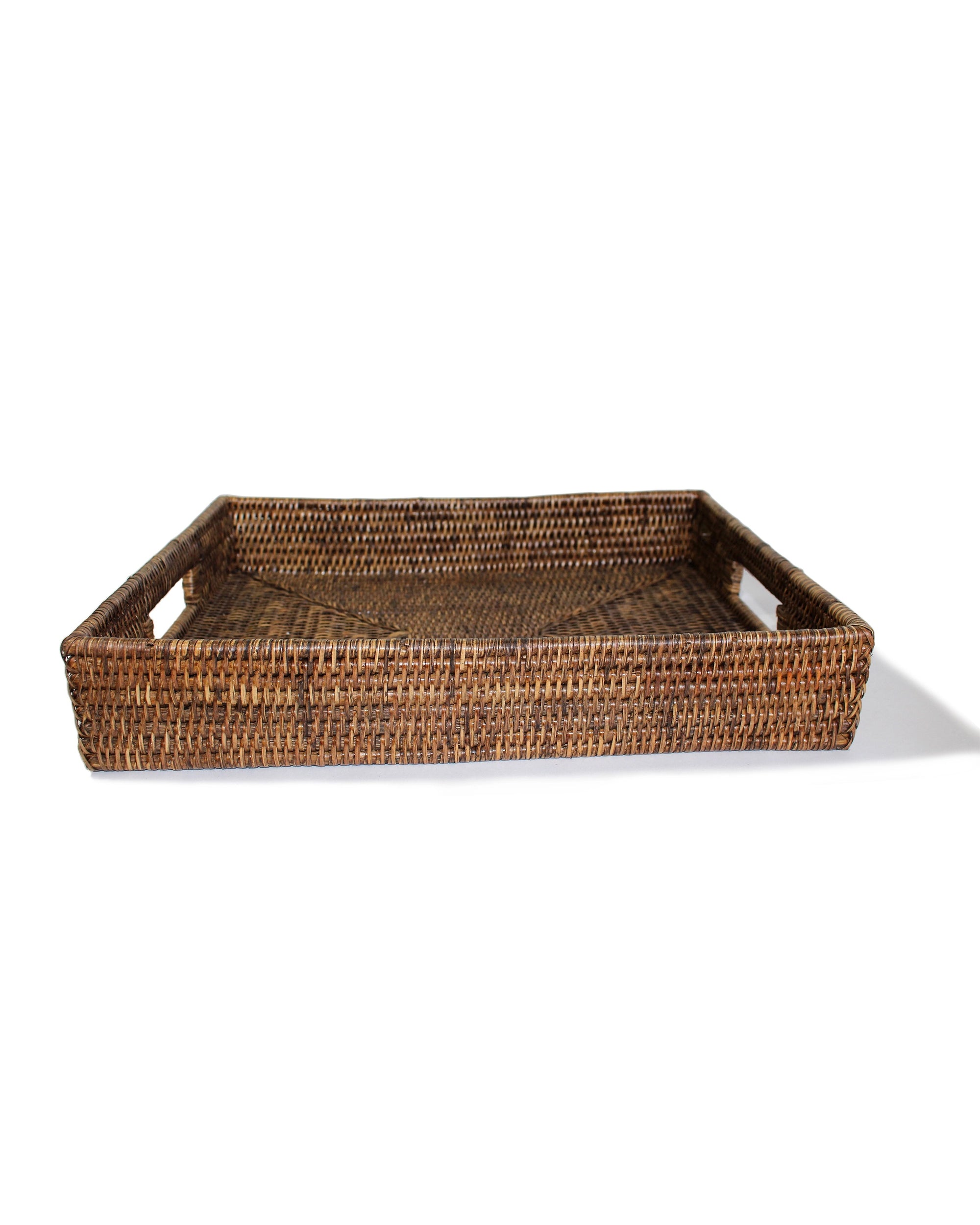 The Rectangular Tray AB by Faire is a handcrafted wicker tray with handles on each end, ideal for sustainable home decor and shown against a white background.