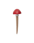 The Accent Decor Red Spore Plant Stick features a red and white spotted mushroom design with a rounded cap and beige stem, creating a stylish home accent when displayed against a plain white background.