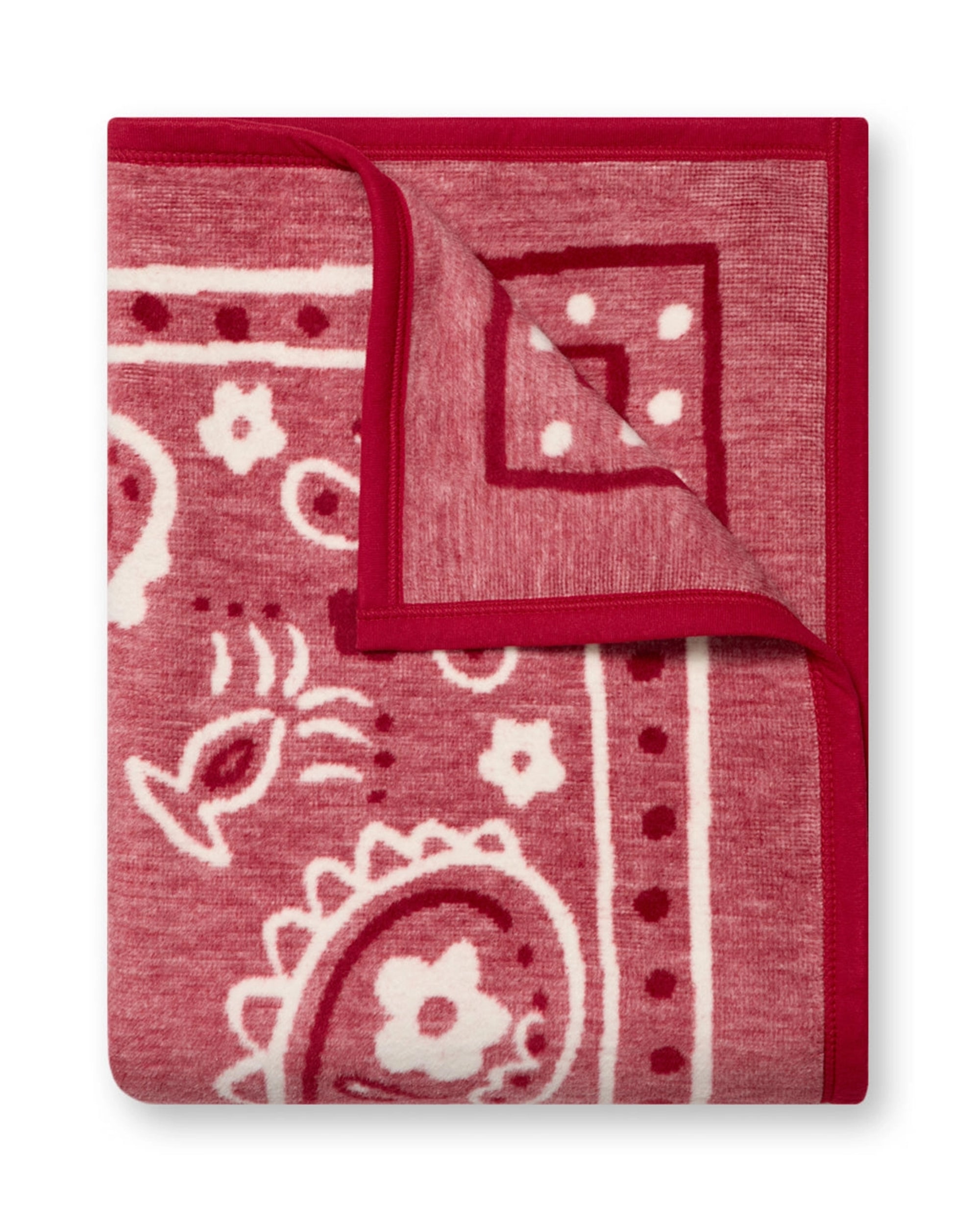 The Faire Vintage Bandana Blanket features a nostalgic red and white paisley and floral print with bold borders and contrasting edges, shown folded on a white background.
