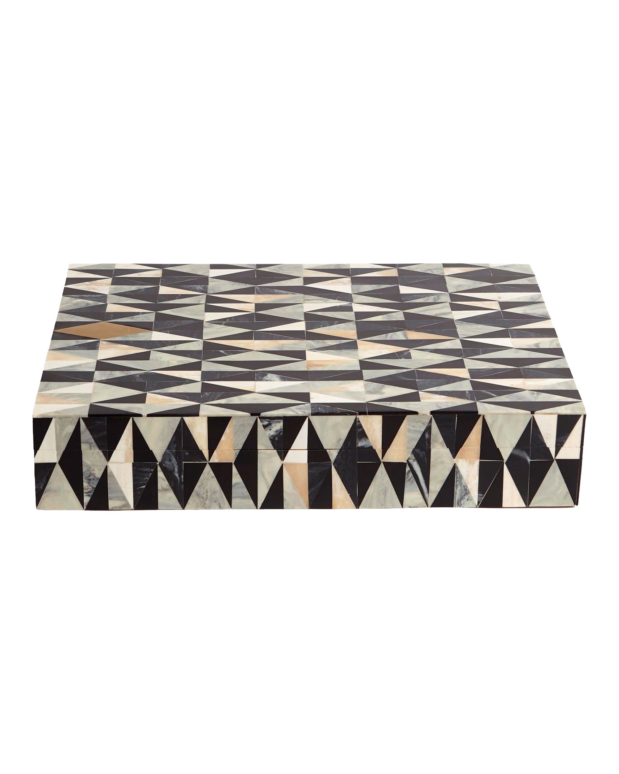 The Calisson Diamond Box by Global Views showcases a geometric triangle pattern in black, white, and tan with a brass diamond accent. Its low, modern design makes it an elegant choice for contemporary interiors.