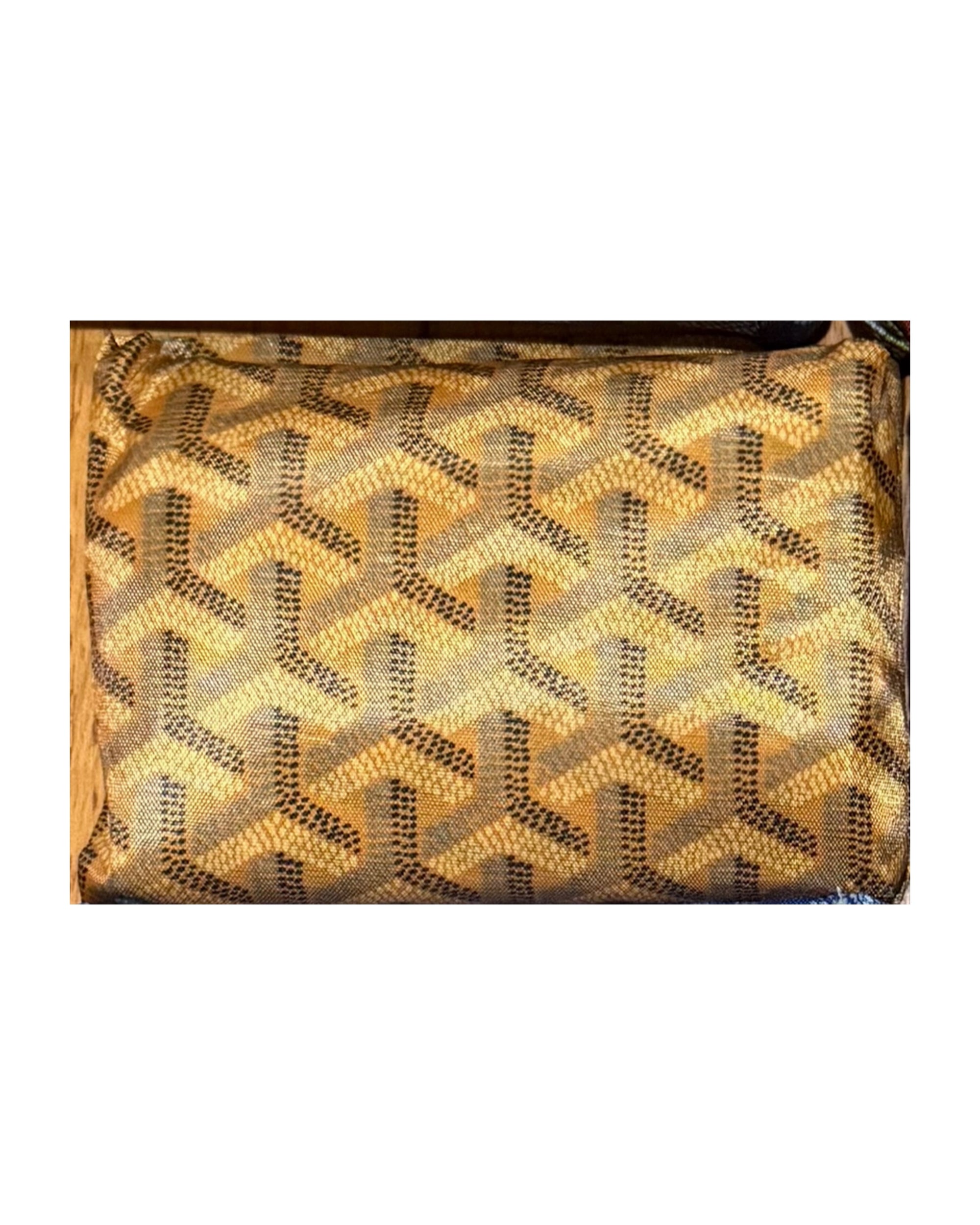 A close-up of Faire's Reusable Shopping Bags shows textured fabric with repeating geometric Y-shaped patterns in gold, beige, and brown—ideal for a designer-inspired, eco-friendly shopping accessory.