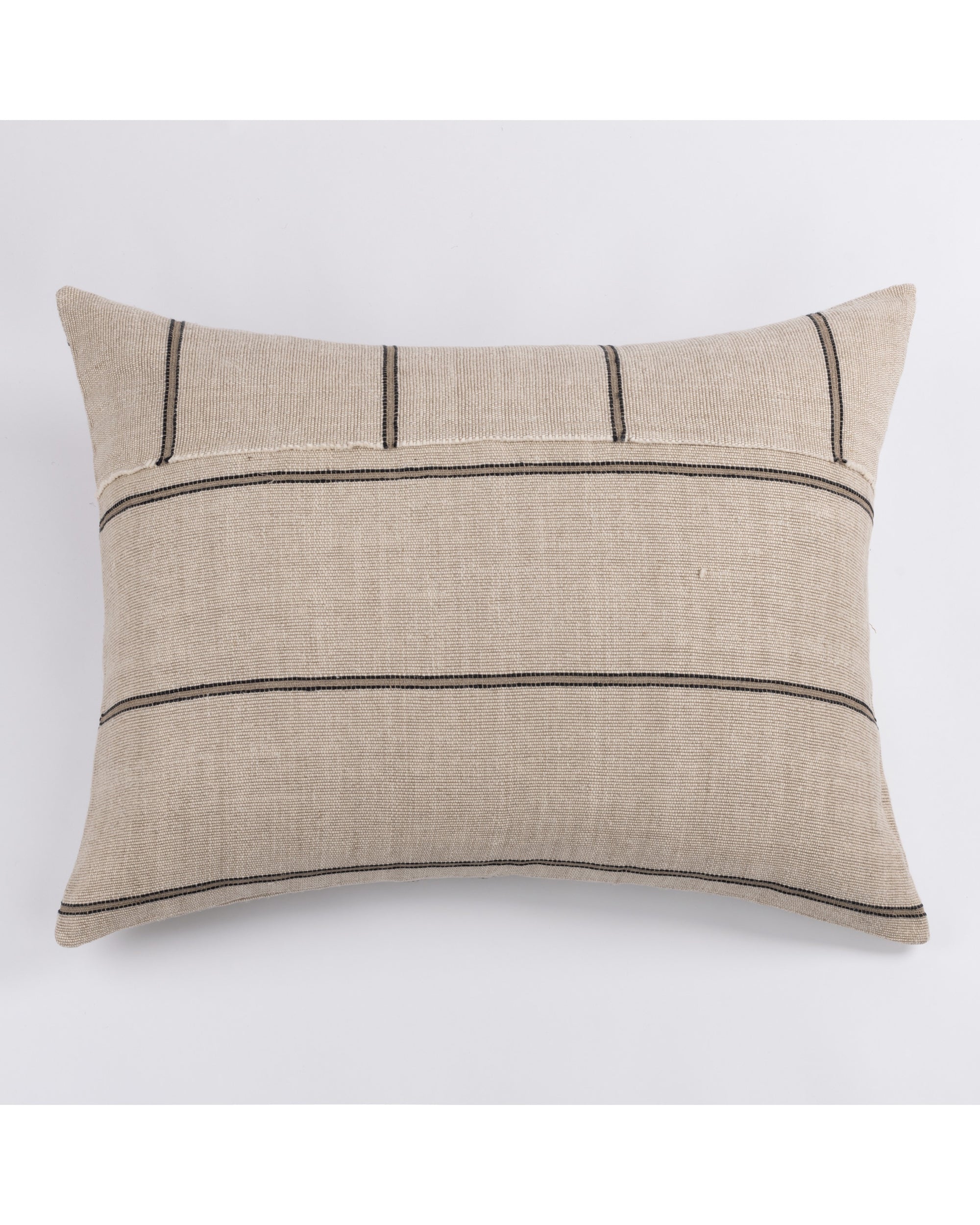 The Amity Home Rhodes Dutch Euro pillow features a rectangular beige design with chunky cotton linen and bold black stripes arranged both horizontally and vertically on a plain white background.