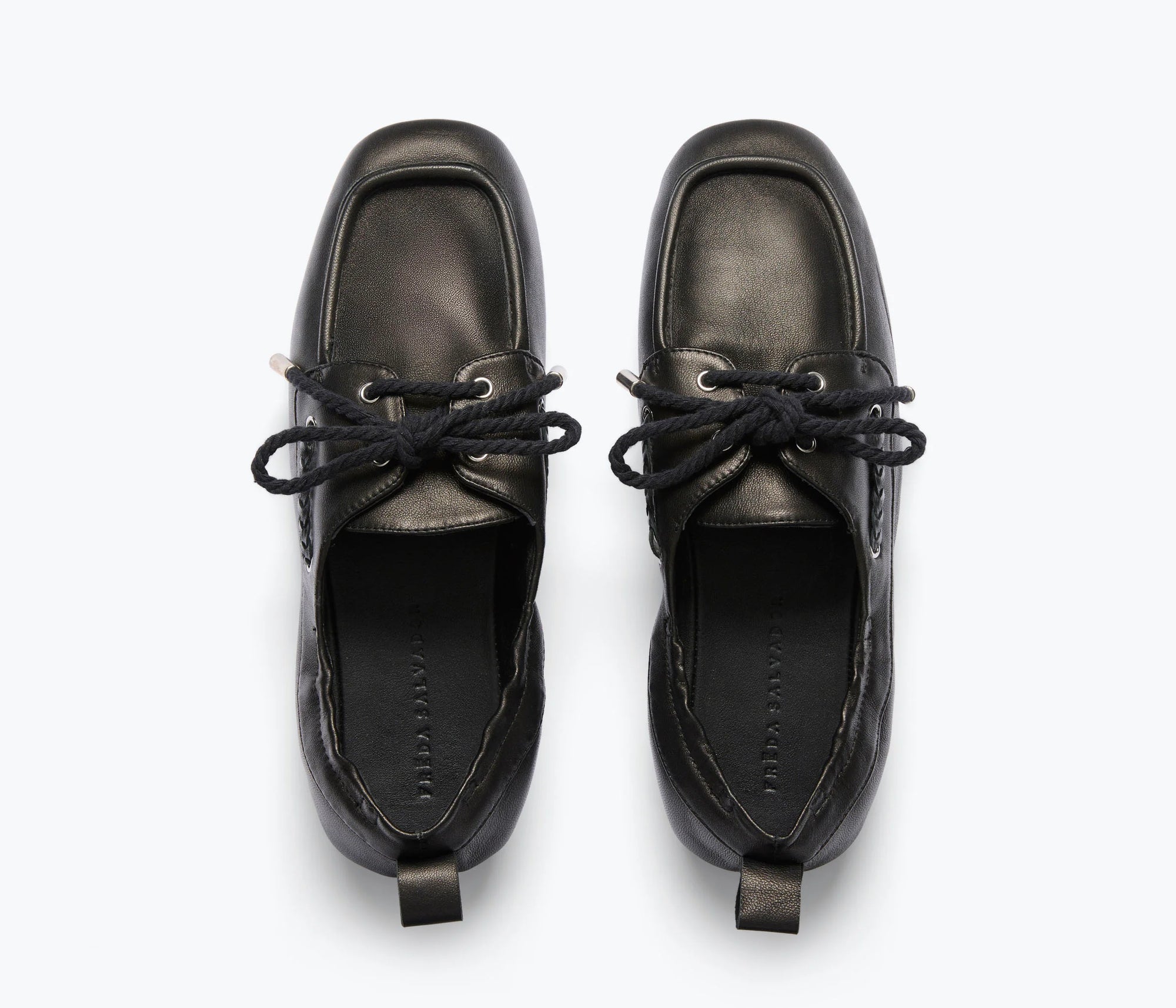 The Freda Salvador RIA Driver Loafer in black Nappa leather features square toes and black laces, shown from above against a light background.