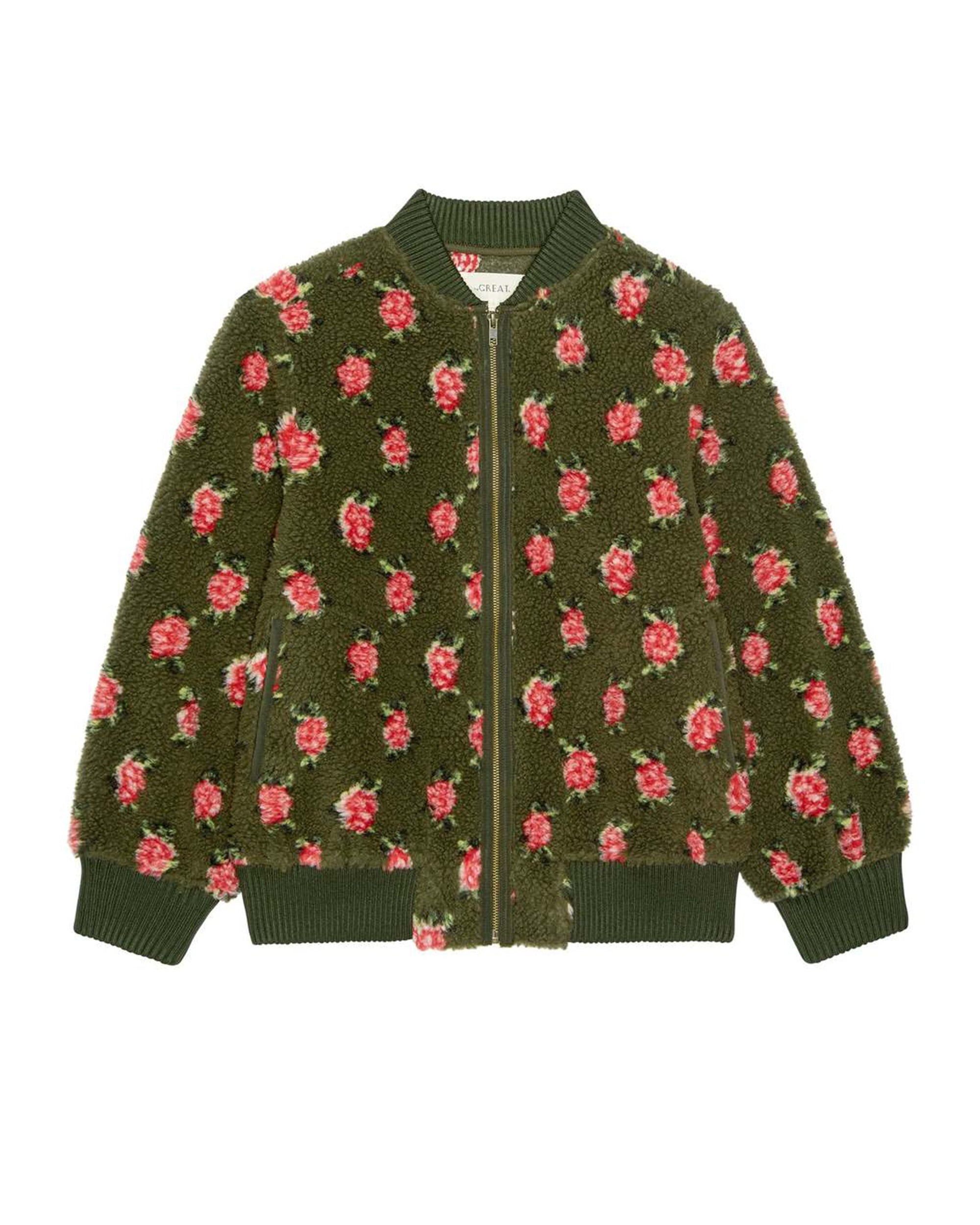 The Great Inc. Zip Front Plush Bomber is an army green fuzzy jacket with a front zipper, ribbed cuffs, collar, and hem, adorned with a rose pattern of pink and red flowers with green leaves.