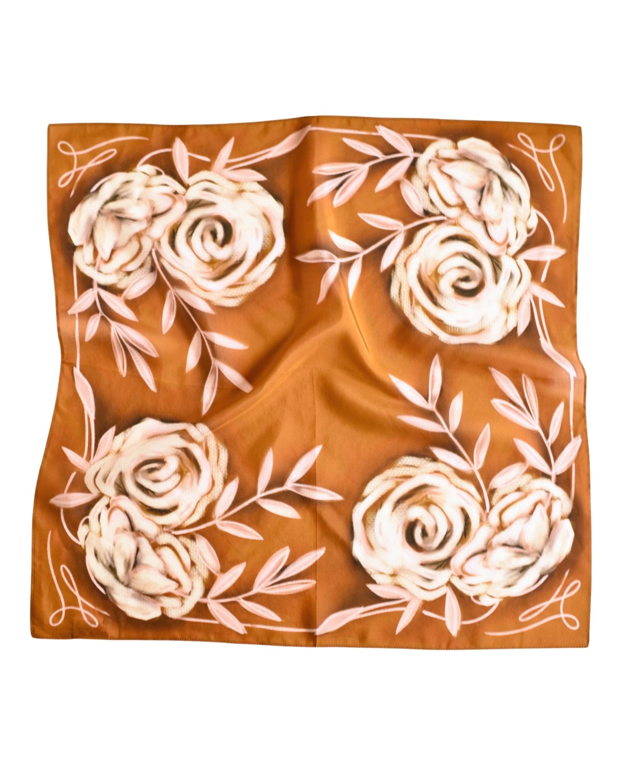 The Faire Rustic Wild Rose Western Silk Scarf features a brown background with white and light pink floral and leaf patterns symmetrically edged—a chic, sustainable cowgirl accessory.