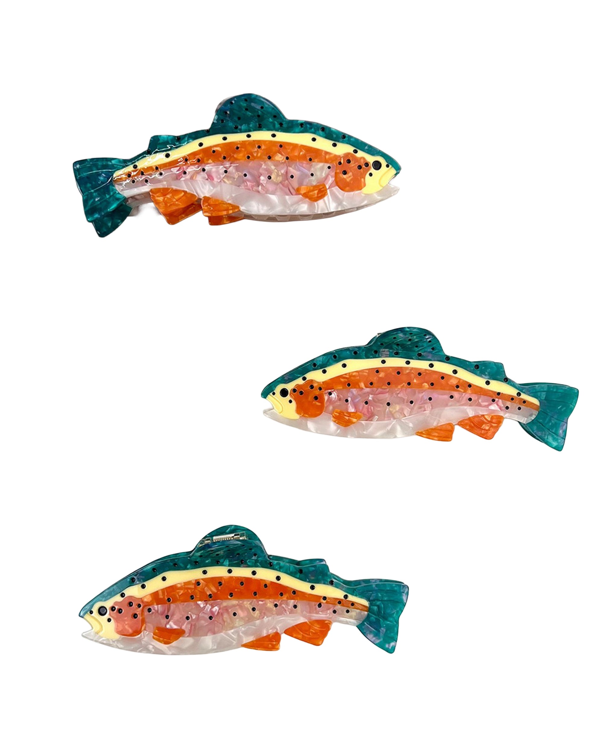 The Faire Salmon Claw Clip, inspired by colorful fish with green, orange, yellow, pink accents and black spots, is displayed against a plain white background.