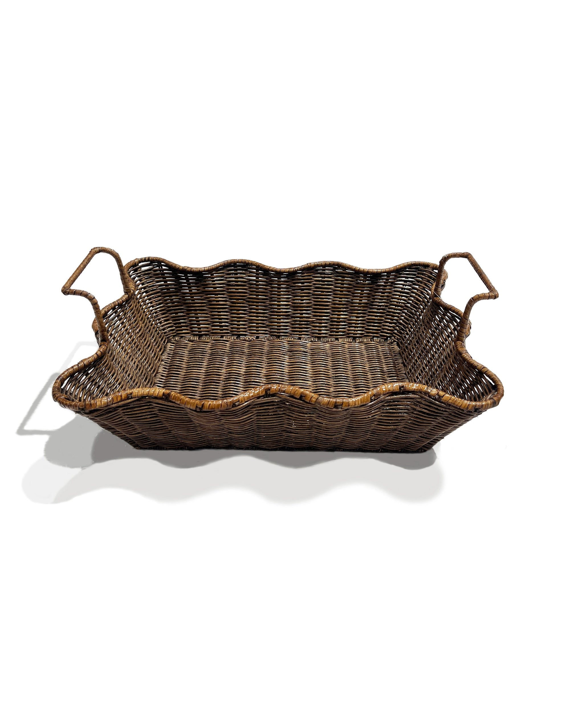 The Small Scalloped Tray Brown by Faire features wavy scalloped edges and two handles, shown against a white background with a shadow below.