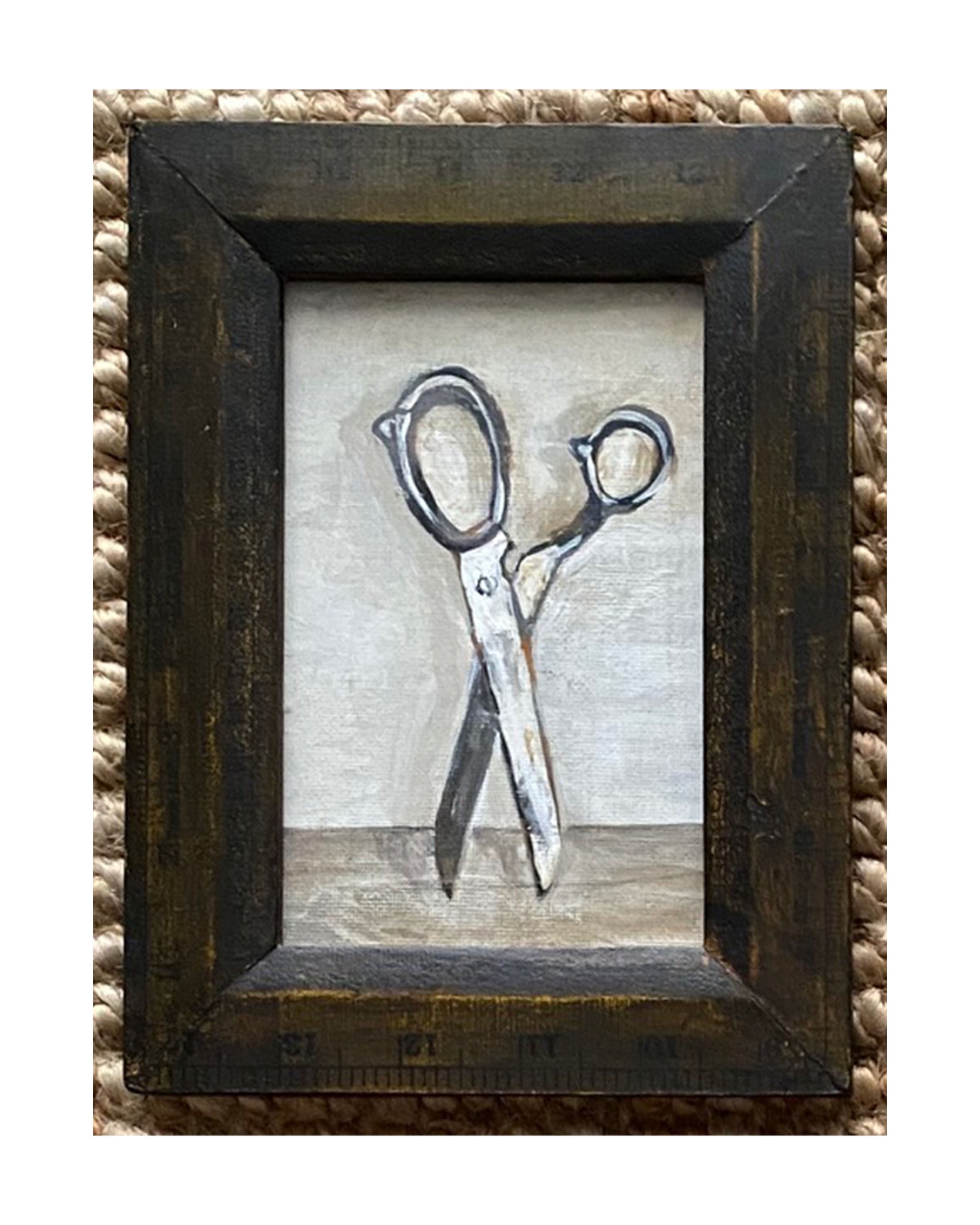 OBJECTS by Tak Design: A local artist’s hand-painted, framed art piece features a pair of slightly open scissors on a neutral background in a rustic dark brown vintage frame.