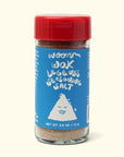 A glass jar of Faire's Woon Wok Legend's Seasoning Salt with a red lid and blue label featuring a smiling rice character. This 2.5 oz (71 g) blend adds bold flavor to any dish.