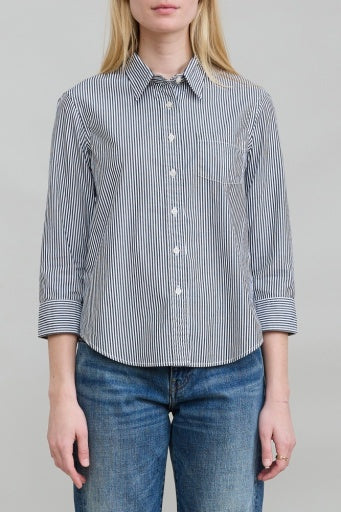 Black striped cotton Denimist Adrienne shrunken shirt with rolled sleeves, styled with blue jeans.