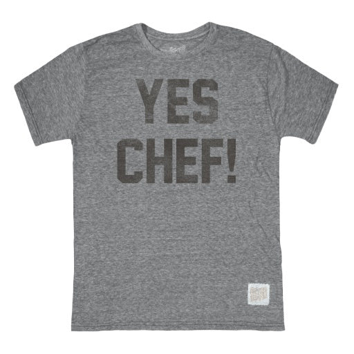 The unisex triblend gray t-shirt from Wildcat Retro Brands features the bold black "YES CHEF" lettering on the front, providing both comfort and a touch of culinary style.