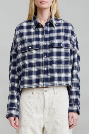 Blue and white plaid Denimist Cropped Work Shirt with relaxed fit, styled with high-waisted cream pants.