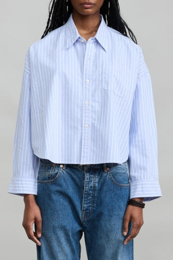 Bailey Cropped Stripe Oxford shirt by Denimist in blue stripes, styled casually with blue jeans against a plain backdrop.