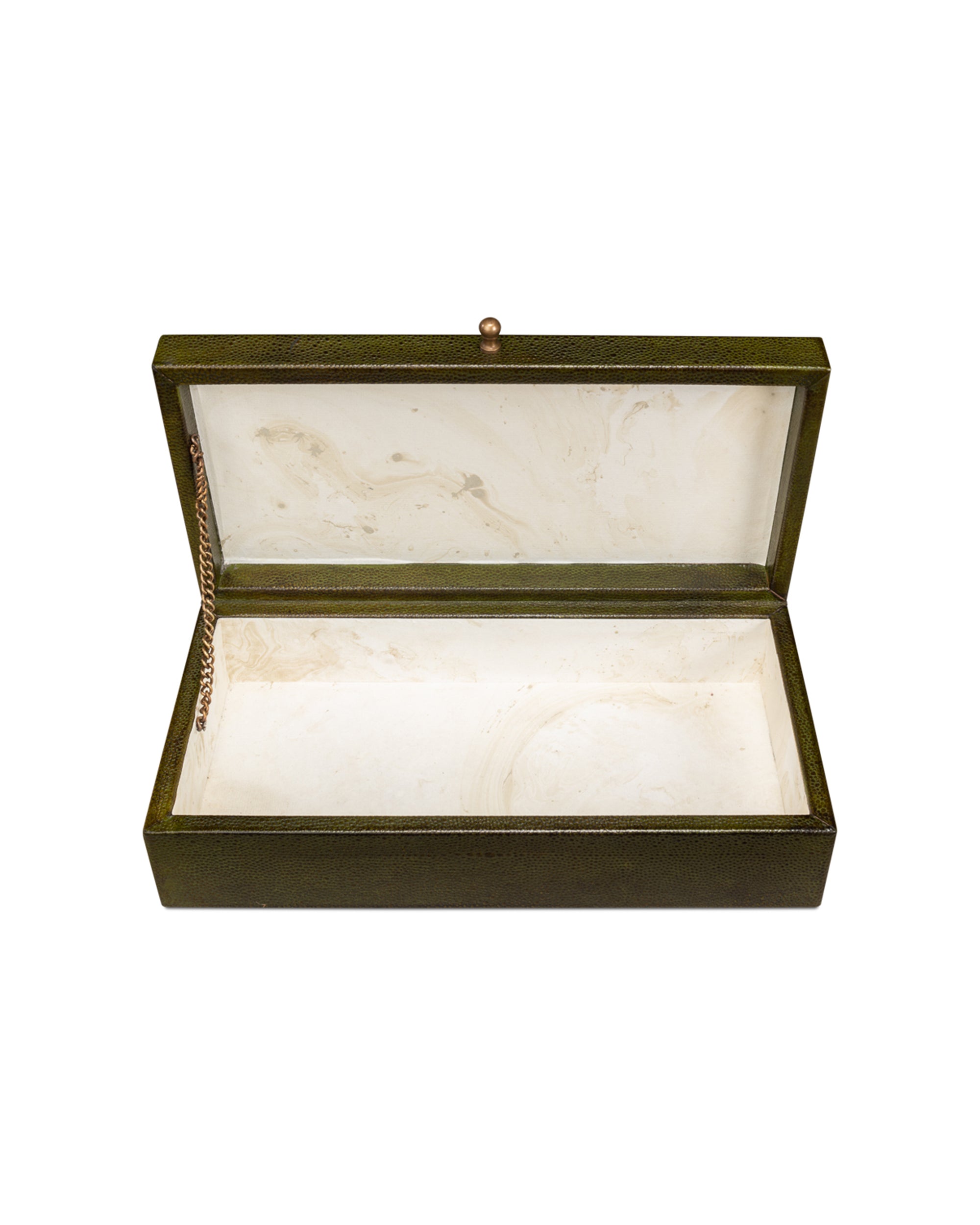The Sarreid Gatsburg Shagreen Box is a rectangular, dark green leather storage box with a hinged lid, gold chain detail, and a white marbled interior that exudes transitional elegance.