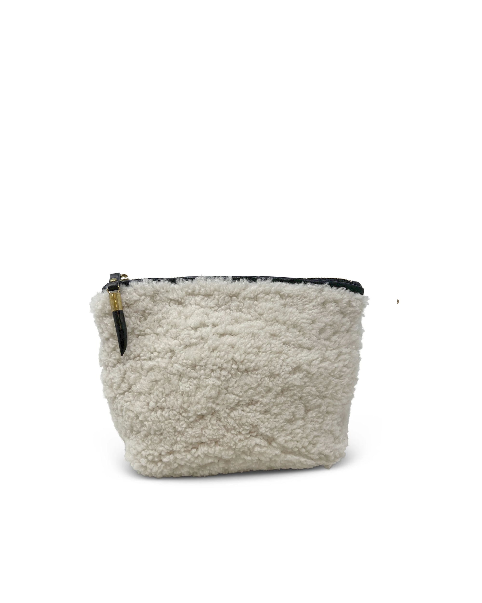 The Kempton & Co. Makeup Bag is a small, soft, cream-colored natural shearling bag with a fluffy, textured surface and a dark zip top closure, displayed against a plain white background.