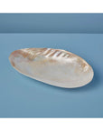 The Be Home 07-01 Seashell Footed Dish features an iridescent, oval shape and footed base—ideal for adding ethically crafted nautical decor to your space.