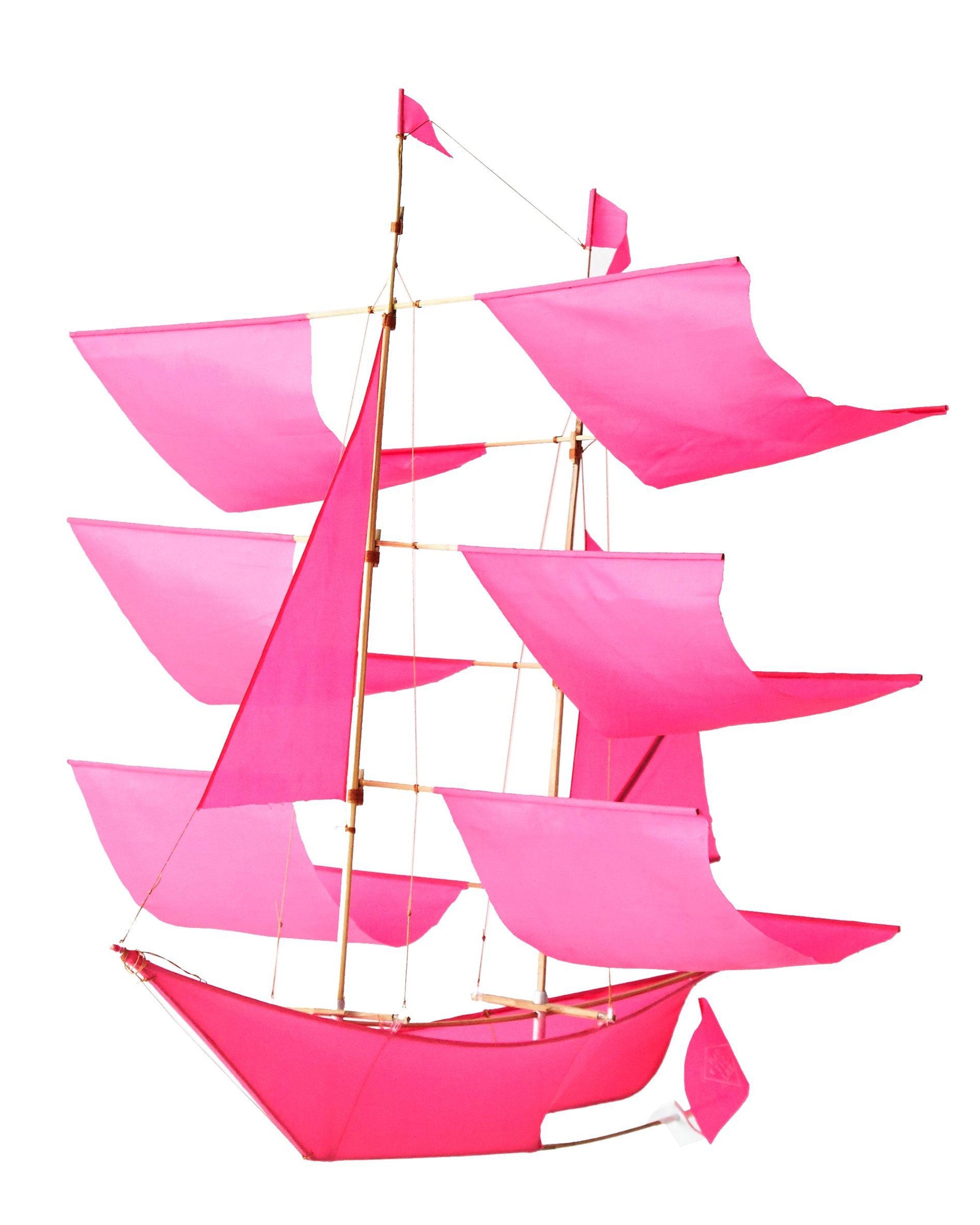 The Faire Sailing Ship Kite features a handmade design with multiple bright pink sails and a wooden frame, shown against a white background.