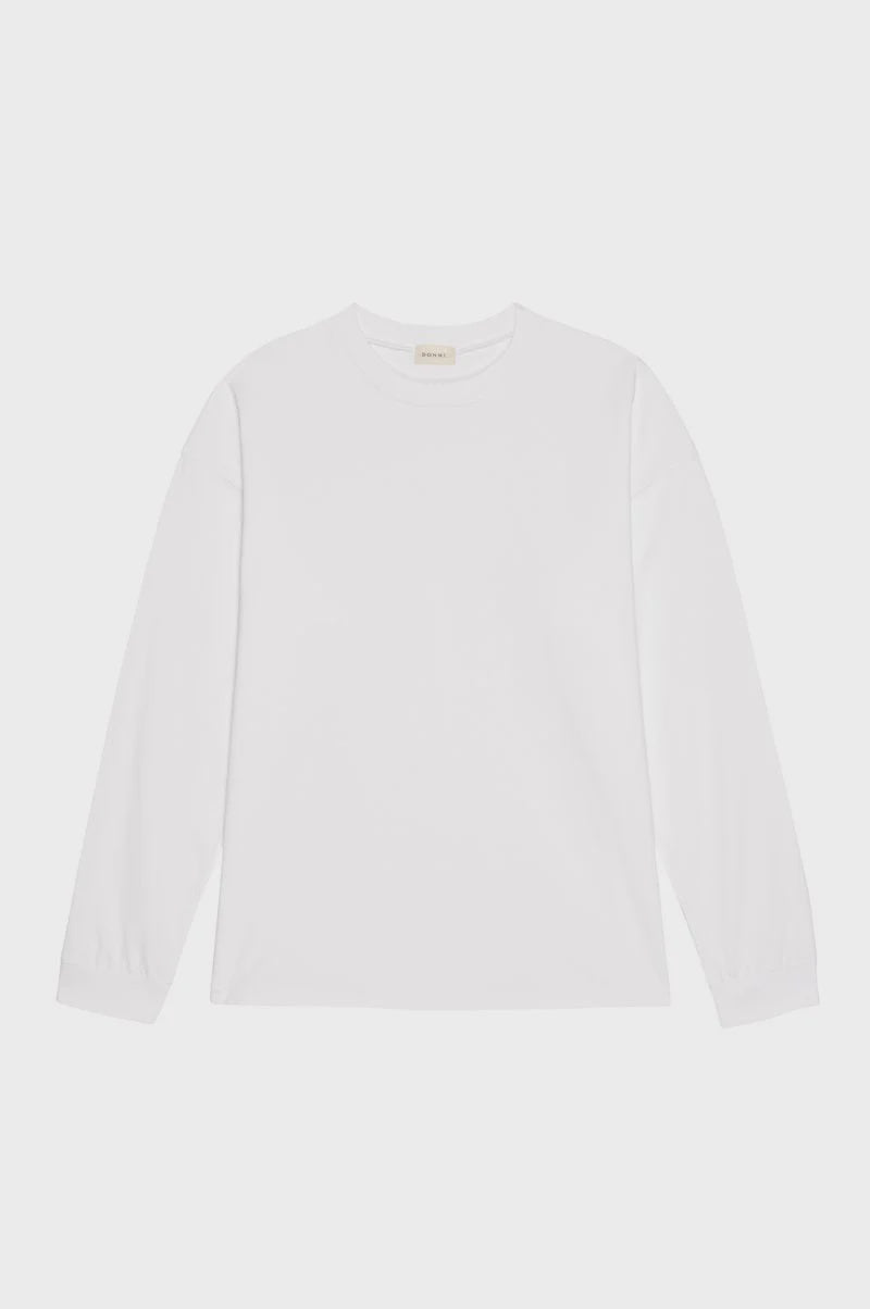 The Donni Jersey Boyfriend Long Sleeve, a plain white crew neck t-shirt, is shown on a white background.