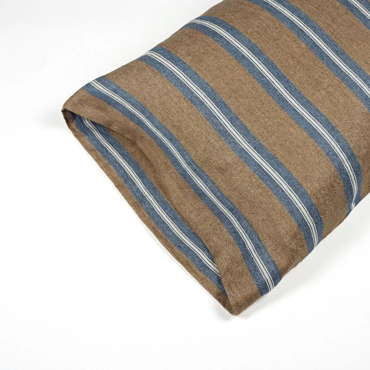 A close-up of the Libeco Home Salem Pillow Case shows its brown fabric with blue and white stripes, neatly folded on a white surface.