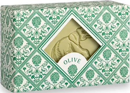 A Faire Hand and Body Soap Bar in a decorative green and white box with a cut-out window showing an embossed elephant and a label reading "OLIVE." Crafted by a Provence soap maker.