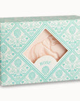 A decorative teal floral box from Faire reveals a rose-scented Hand and Body Soap Bar shaped like an elephant, inspired by Provence, with "ROSE" printed below the soap.