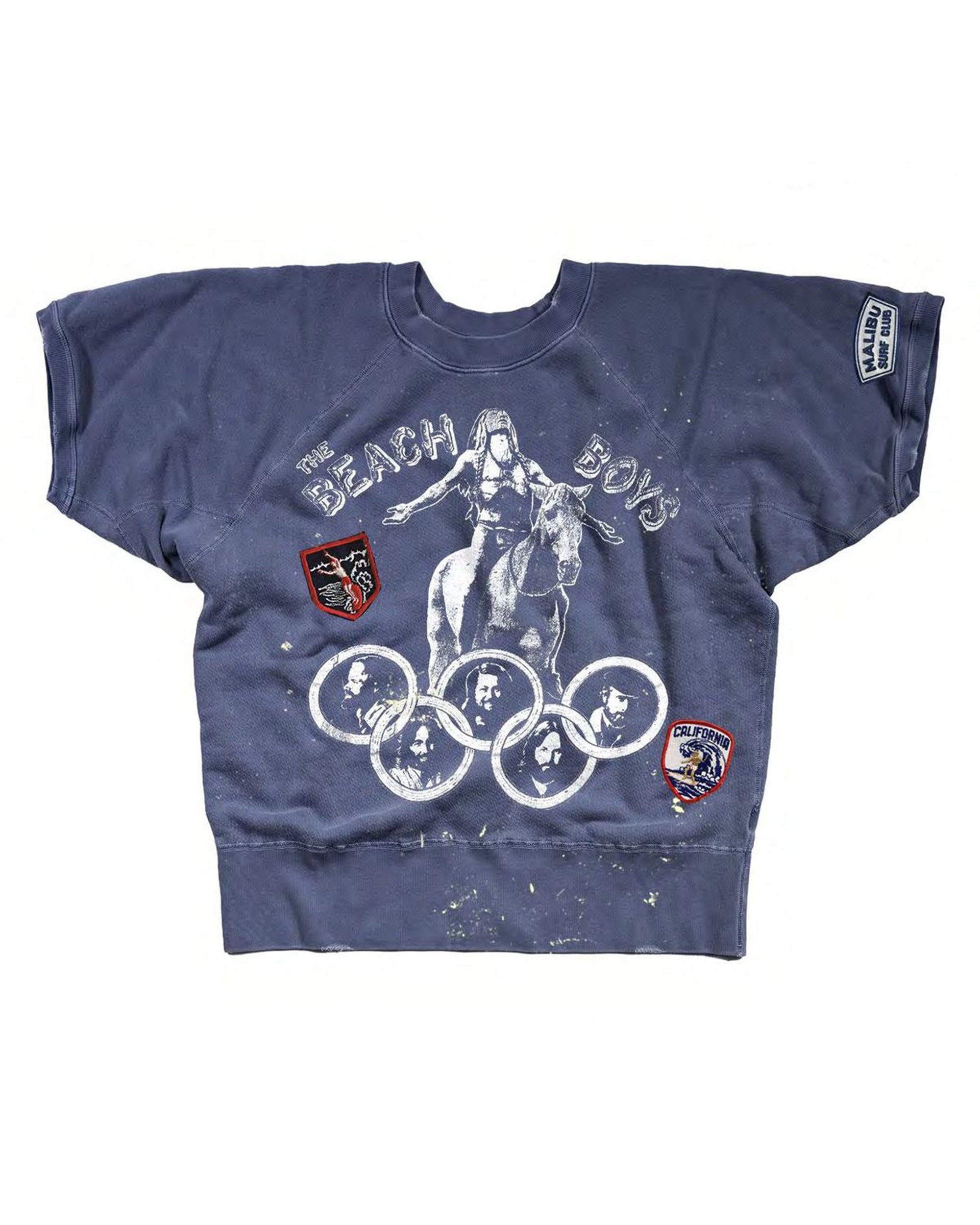 The Made Worn Beach Boys Shrunken Sweatshirt is a vintage navy blue piece with three colorful patches, plus a white graphic of a woman on horseback above Olympic rings.